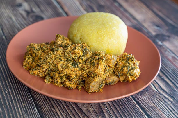 Garri with Egusi & Chicken. image