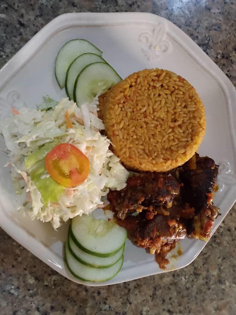 Jollof rice & Goat meat. image